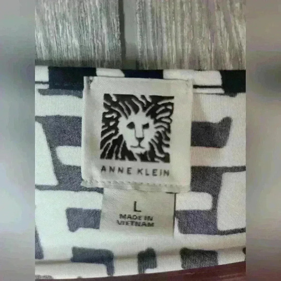 Ann Klein black and white design dress with orange strip stripe on bottom. - Picture 4 of 6